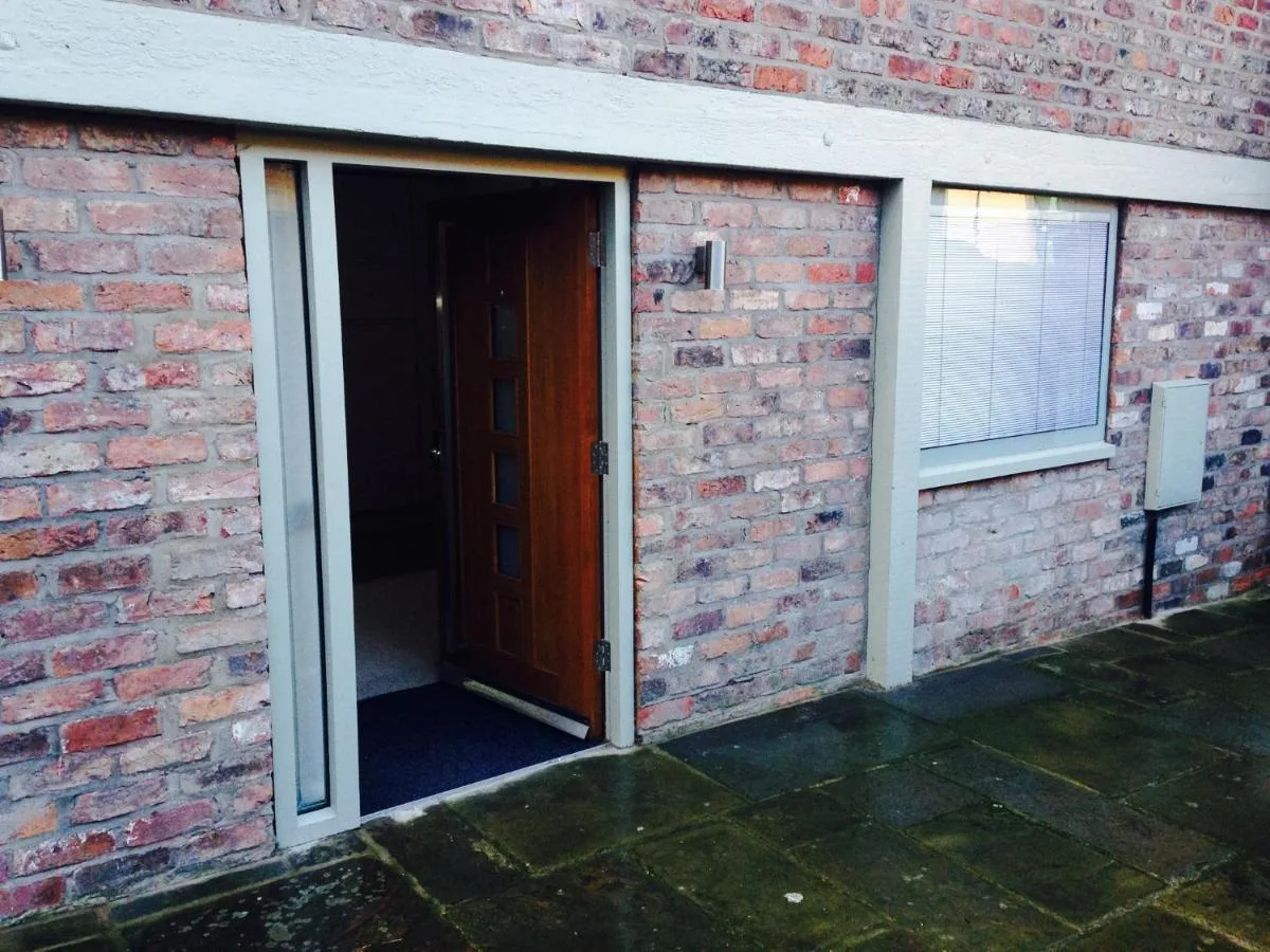 a door in a brick building with a window at York Aparthotel in York
